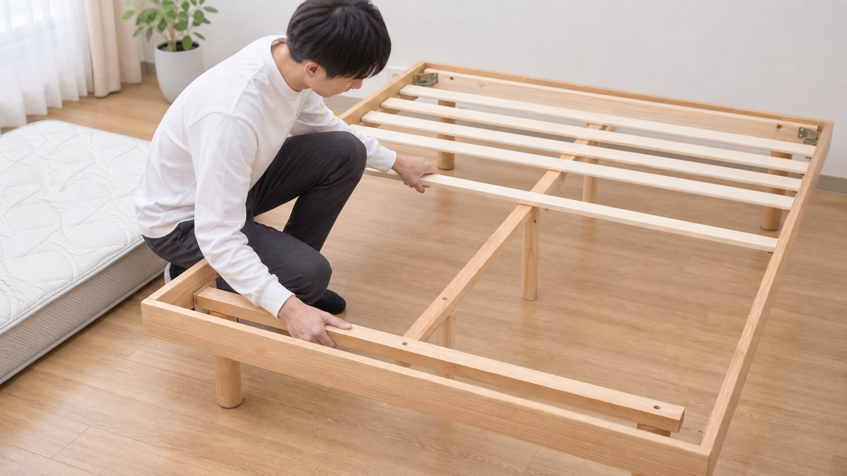 すのこベッドの脚やネジを確認する様子